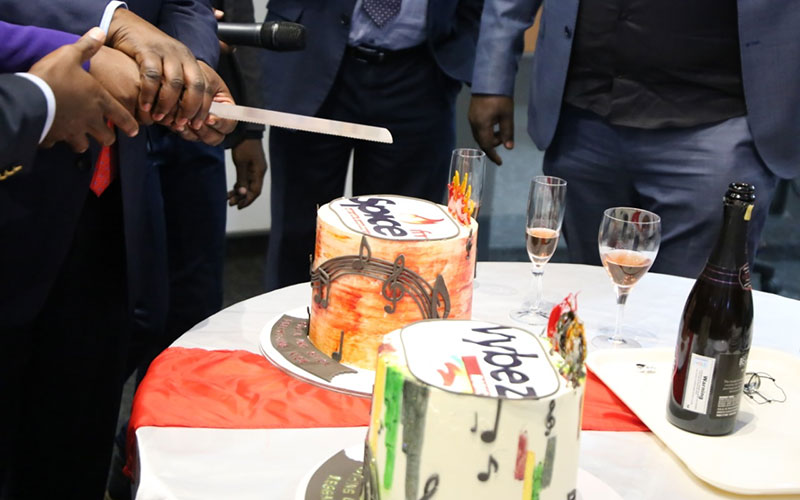 Staff and officials including Standard Group CEO Orlando Lyomu and ICT PS cut a cake to mark the launch of two new stations on August 20, 2019